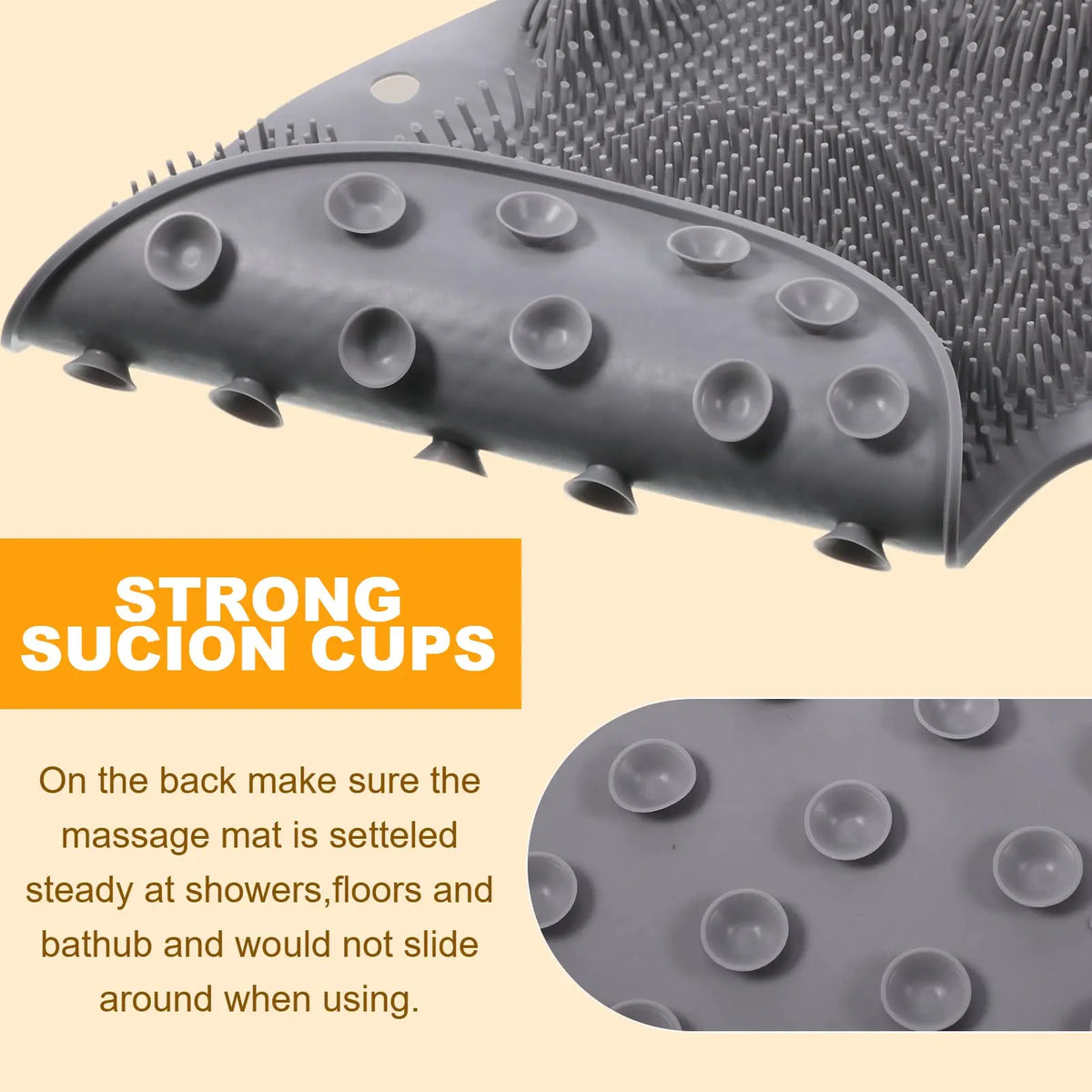 Gray silicone massage mat with suction cups designed to stay steady on shower floors and bathtubs
