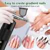 Hands are using a mini air compressor nail art spray tool to create gradient nails on fingers.