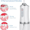 A white portable USB rechargeable water flosser with three modes: Weak, Strong, and Pulse.