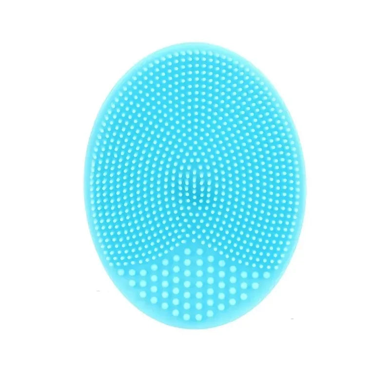 A bright blue silicone facial cleansing brush with numerous small, round bristles.