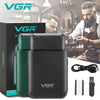 A black VGR Voyager electric beard shaver and trimmer device shown next to its packaging and accessories.