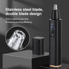 A black portable electric nose hair trimmer with a stainless steel double blade design shown on a dark surface.