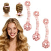 A woman shows off long, wavy blonde hair alongside several pink heatless silk hair rollers.