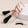 A professional stainless steel eyelash curler set with rose gold-toned metal and black silicone grips.