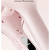 Close-up of a pink hair styling tool with a thermostat and power switch, demonstrating 3-speed temperature control.