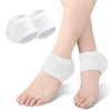 White silicone heel protectors shown on a foot and separate pads.