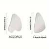 Outil gua sha en acier inoxydable en forme de cœur, dimensions 5.9x4.5 cm et épaisseur 5.7 cm.