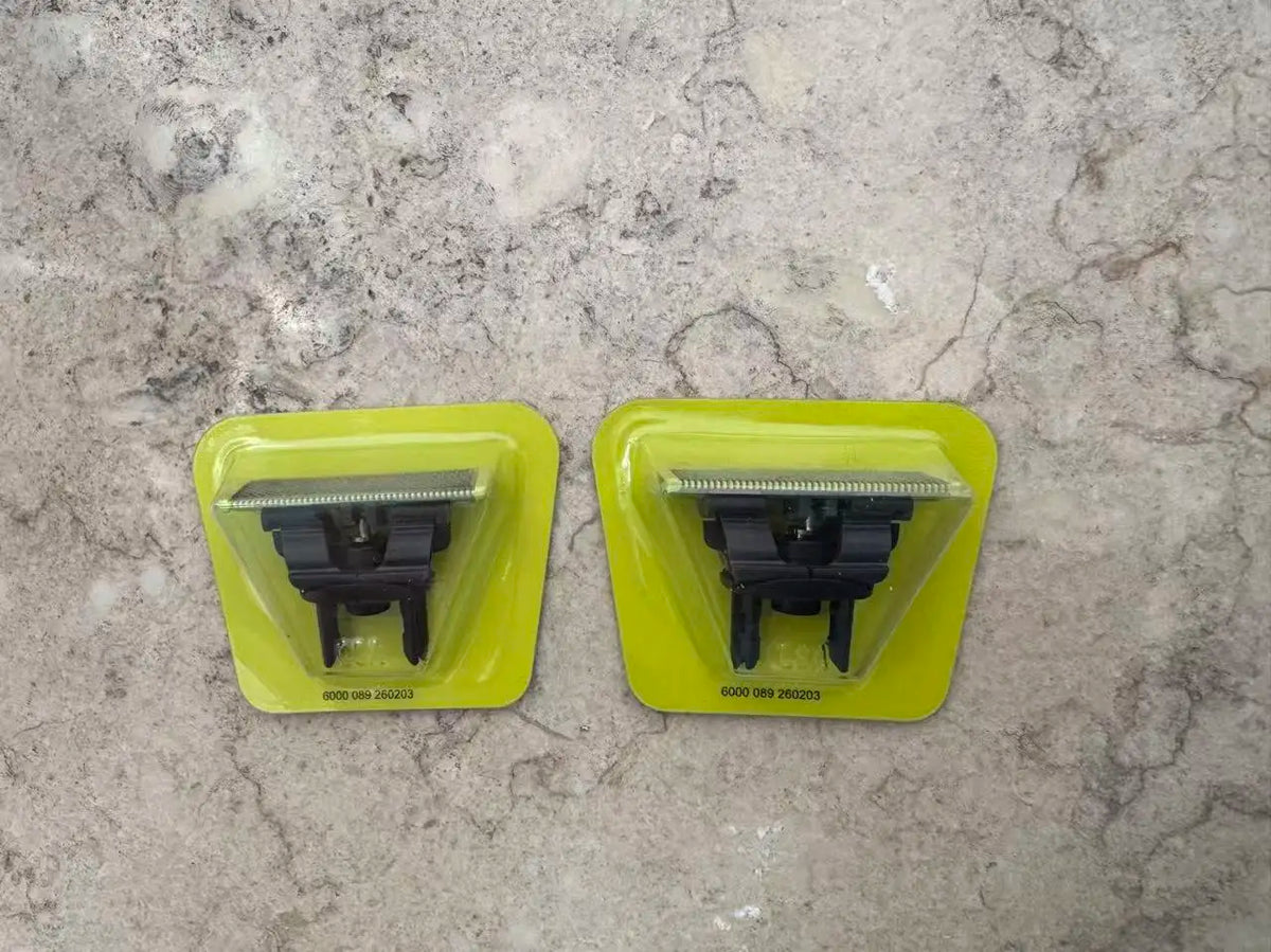 Two yellow plastic attachments for a precision electric beard trimmer