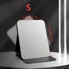 A white foldable portable makeup mirror is shown against a dark background with measurement lines.