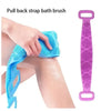 A hand is pulling back a blue silicone bath brush from the skin, next to a purple silicone back brush.