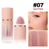 A pink liquid matte blush stick in a gold tube and a swatch of the product on skin.