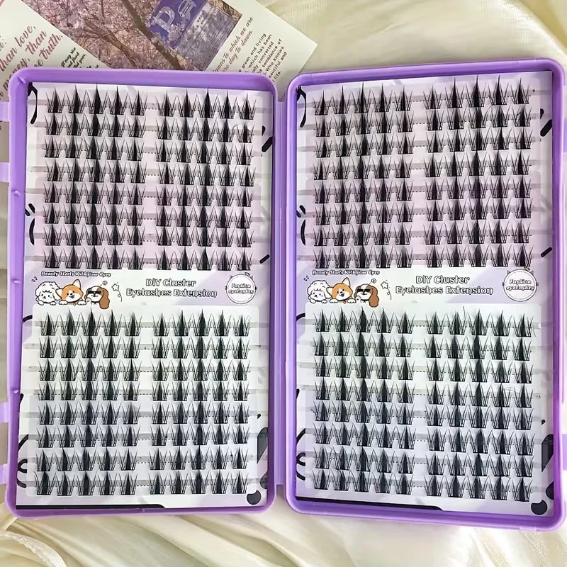 A pair of purple cosmetic palettes containing 320 piece Korean style eyelash clusters for DIY makeup