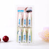 A clear plastic container holding three tubes of EYE eyelash glue for false lashes.