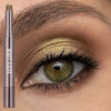 A cosmetic product featuring a rose gold eyeshadow stick with a double brush applied to an eye.