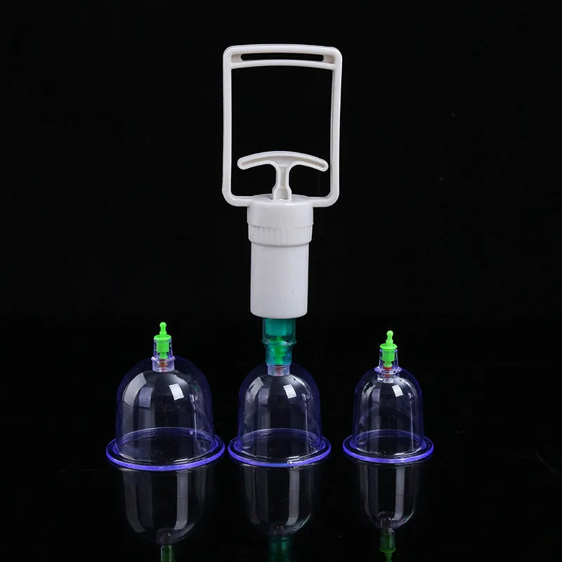 Kit de thérapie par succion avec pompe en plastique blanc et trois tasses en verre.