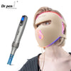 A woman is using a Dr.pen auto microneedle system device on her face for skin treatment.