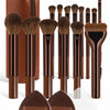 A set of 14 professional makeup brushes and sponges in brown and black packaging.