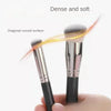 A pair of dense and soft makeup brushes with diagonal curved surfaces shown against a white background.