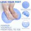 A blue non-slip shower foot scrubber mat with flexible bristles and suction cups for exfoliating feet.