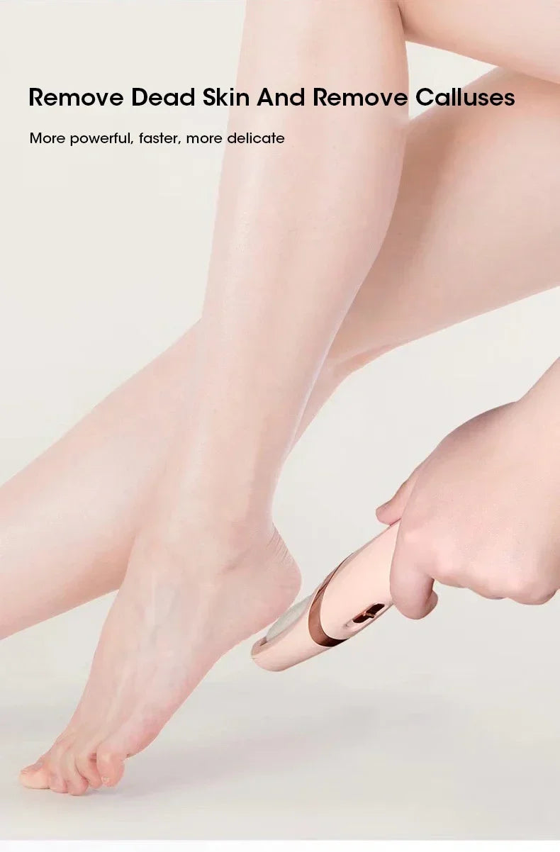A hand is using an automatic electric foot grinder on a person's foot to remove dead skin and calluses.