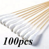 A collection of 100 precision wooden cotton swabs with white tips arranged diagonally.