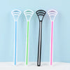 Four silicone tongue scrapers in white, green, black, and pink displayed against a light blue background.