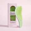A light green anti-static detangling comb with scalp massage tips is shown next to its packaging box.