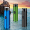 Three portable electric shavers in blue, green, and black standing upright on water.