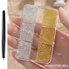 A clear box containing various sizes of gold mixed stainless steel beads for nail art decorations.