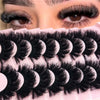 Close-up of a pink lash tray filled with natural mink striped false eyelash extensions.