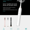 White sonic toothbrush shown with various brush heads and cleaning modes displayed below.