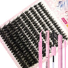 A pink DIY lash extension kit with black false lashes displayed on a sheet.