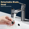 A hand is using a detachable blade head on a modern chrome faucet to rinse and clean.