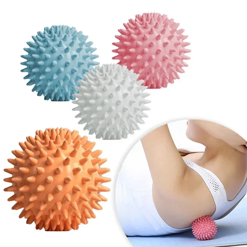 A collection of pink, blue, white, and orange deep tissue massage balls shown next to a hand applying one on a foot.