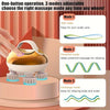 A hand is operating a portable electric scalp massager with three adjustable modes on a pink surface.