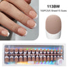 A set of 15 nude pink ballet length false fingernails in various sizes displayed on a hand and packaged in a clear case.
