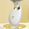 A white electric facial lifting massager with a gold accent, shown against a light background.