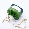 A package of soft cotton disposable face towels for cleansing and makeup removal in green packaging.