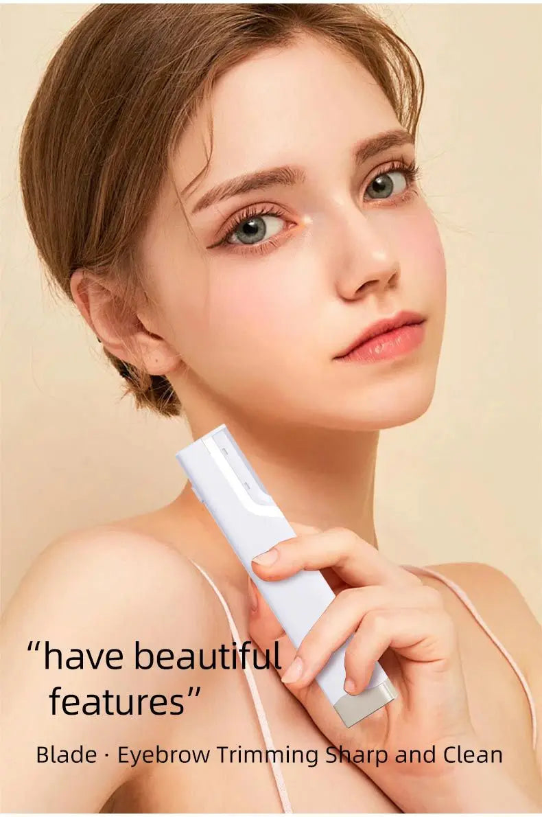 A woman is using a white sonic dermaplaning tool for eyebrow trimming and facial hair removal.