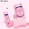 A pink portable mini eyelash curler set displayed on a clear stand.