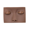 A realistic silicone mannequin head with sculpted features for eyelash extension practice.