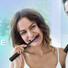 A smiling woman and man are shown using toothbrushes, with text promoting superior clean every time.
