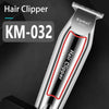 A silver Kemei KM-032 hair clipper is shown against a dark background.