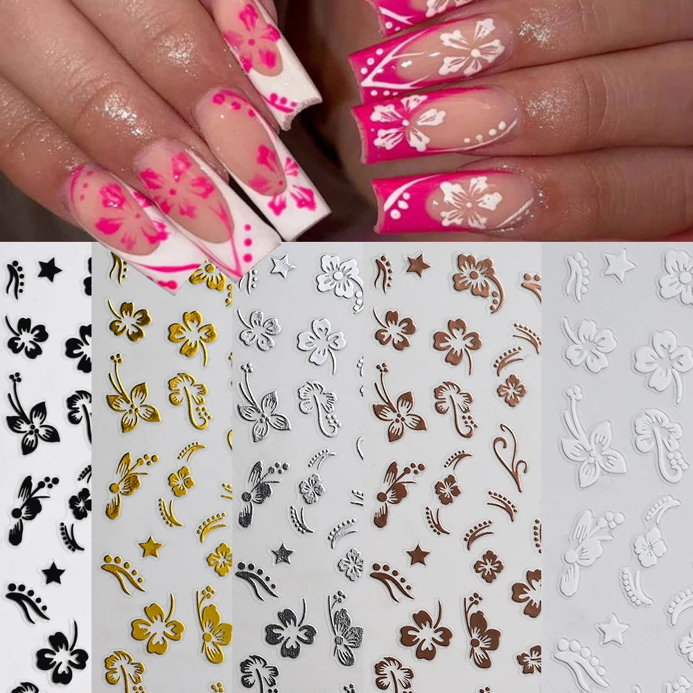 Close-up of fingernails decorated with multi-color 3D hibiscus flower nail decals