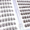 A close-up of individual lash clusters for eyelash extensions shown in various shades and lengths.