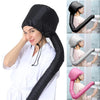 A woman wearing a black adjustable hair drying cap for salon or home use.