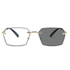 A pair of gold-framed photochromic reading glasses with dark lenses.