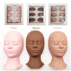 Three silicone mannequin heads in pink, black, and yellow colors showing realistic eyelash extensions.