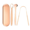 A set of rose gold reusable stainless steel tongue scrapers for oral hygiene