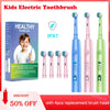 A box of kids electric toothbrush and four replacement brush heads with cartoon designs shown next to the product.